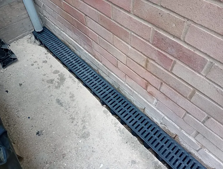 aco channel fitted along wall