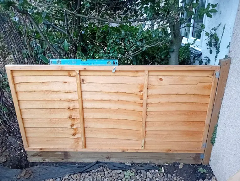 fence panel with level ontop