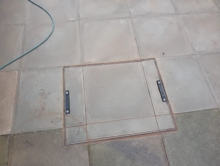 recessed manhole lid in patio