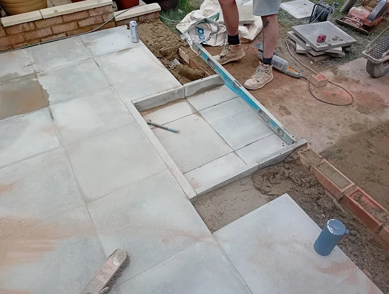 Patio step being installed